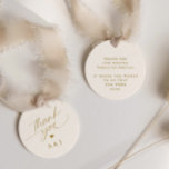 Romantic Gold and Ivory Cream Wedding Thank You Favor Tags<br><div class="desc">Elevate your wedding favors with our Round Romantic Gold and Ivory Wedding Favor Tags. These exquisite tags feature a delicate romantic script that conveys a heartfelt "thank you, " along with the loving initials of the couple, creating a personalized touch. In a harmonious blend of soft cream and shimmering gold,...</div>