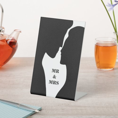 Romantic intimate couple kissing silhouette pedestal sign