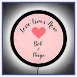 Romantic Pink & Black Love Lives Here Heart LED Sign<br><div class="desc">Lovely design declaring LOVE LIVES HERE - decorated with a glitter heart and a place to add your/recipient names. Great for a housewarming gift.</div>