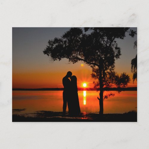 Romantic sunset kiss postcard