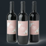Romantic watercolor white flowers wedding custom wine label<br><div class="desc">Elegant and romantic customizable wine labels for your wedding reception, featuring a beautiful bouquet of white gentle watercolor flowers, over a classy pastel pink background. Easily edit the template fields to add the bride and groom names in a modern white script, and your wedding date in a stylish all-caps font....</div>