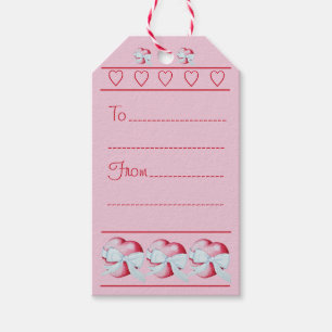 romantic white ribbon wrapped around red heart gift tags