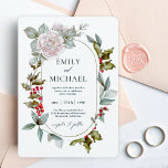 Romantic Winter Floral and Evergreens Wedding Invitation<br><div class="desc">This wonderfully elegant and unique winter wedding invitation was designed especially for weddings during the Christmas holiday season and the winter months. Romantic pink roses mix with beautiful evergreens and holly with red berries to form a perfectly gorgeous combination. The oval frame surrounding your text adds to the tasteful design....</div>
