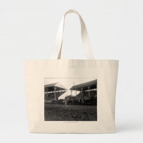 Roping tricks at a rodeo large tote bag