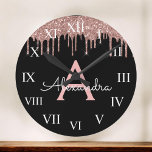 Rose Gold - Blush Pink Black Glitter Monogram Name Round Clock<br><div class="desc">Rose Gold - Blush Pink and Black Sparkle Glitter Monogram Name and Initial Luxury Wall Clock. This makes the perfect sweet 16 birthday,  wedding,  bridal shower,  anniversary,  baby shower or bachelorette party gift for someone that loves glam luxury and chic styles.</div>