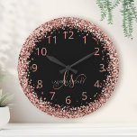 Rose Gold Blush Pink Glitter Glam Monogram Name Round Clock<br><div class="desc">Glam Rose Gold Glitter Elegant Monogram Clock. Easily personalize this trendy chic clock design featuring elegant rose gold sparkling glitter on a black background. The design features your handwritten script monogram with pretty swirls and your name.</div>