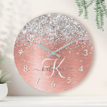 Rose Gold Brushed Metal Glitter Monogram Name Round Clock<br><div class="desc">Easily personalize this trendy chic round clock design featuring pretty rose gold sparkling glitter on a rose gold brushed metallic background.</div>