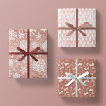 Rose Gold Glitter Pink White  Mauve Christmas Gift Wrapping Paper Sheets<br><div class="desc">this sparkling collection of glamorous glitter features 3 different designs. 1.) solid rose gold glitter faux foil print from seam to seam, with beautiful ornate white snowflakes 2.) blush pink rose quartz sparkle dressed with a seamless pattern of white hand drawn christmas trees, and 3.) a rich mauve / matte...</div>