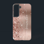 Rose Gold Glittery Foil Girly Signature Samsung Galaxy S22 Case<br><div class="desc">Girly faux sparkly rose gold glitter highlights on the left edge, over a faux blush and rose gold ombre brushed metal foil. The modern girly signature features an elegant white calligraphy font with decorative tails in a vertical format. Customize the font styles or move the sparkle graphics to create your...</div>