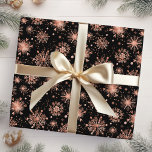 Rose Gold Winter Snowflakes on Black Wrapping Paper<br><div class="desc">This elegant and glamorous wrapping paper is versatile and can be used for giving gifts or art and craft projects. It is ideal for any occasion such as Christmas, birthdays, weddings, bridal showers, baby showers, anniversaries or general gifts. The design features watercolor rose gold faux glitter snowflakes and sparkles on...</div>