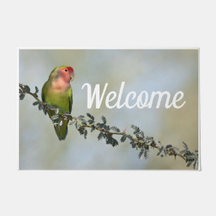 Rosy- faced love bird on a branch doormat