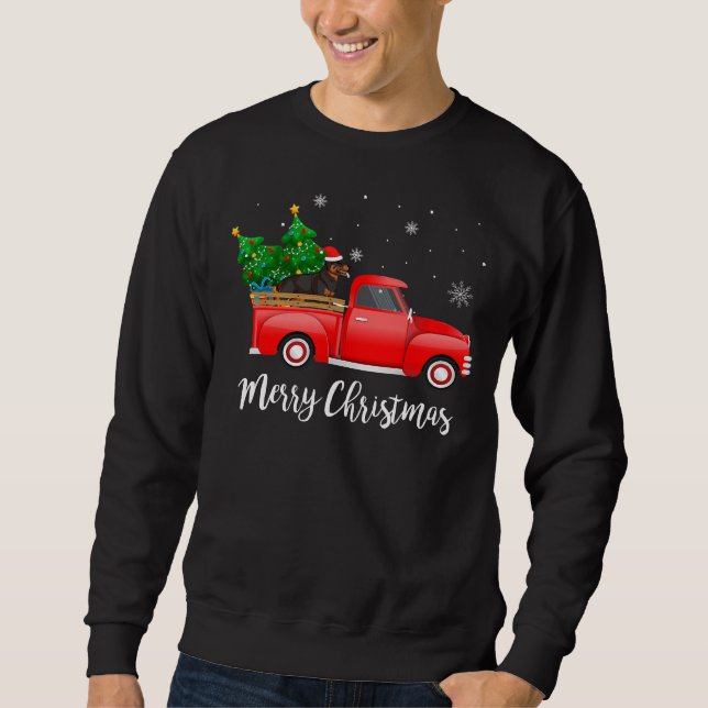Rottweiler Dog Riding Red Truck Christmas Sweatshirt (Front)