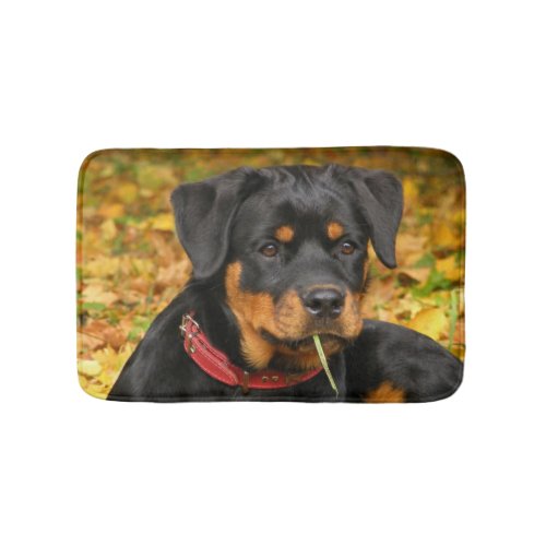 Rottweiler Pup Lying On The Ground In Forest Bathroom Mat