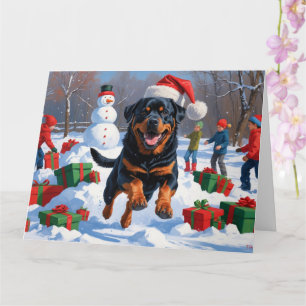 Rottweiler Running in Snow with Christmas Hat Card