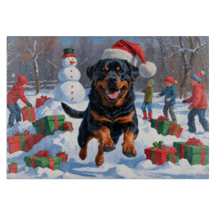 Rottweiler Running in Snow with Christmas Hat Cutting Board
