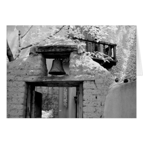 Rough adobe bell in entryway Santa Fe New