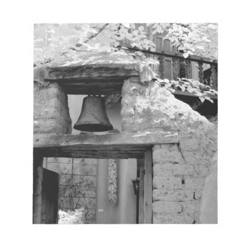 Rough adobe bell in entryway Santa Fe New Notepad