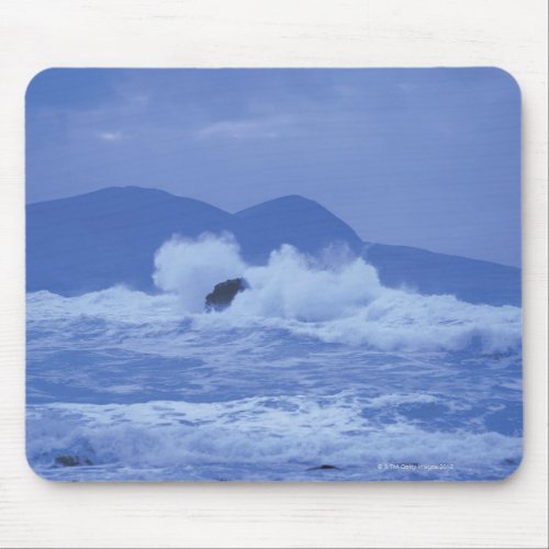 rough seas crashing against a rocky shore mouse pad