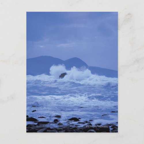 rough seas crashing against a rocky shore postcard