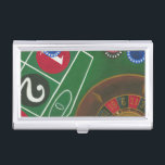 Roulette Table with Chips and Wheel Business Card Case<br><div class="desc">The spinning wheel holds all the power on the roulette table, but the power of this painting is in the lifelike depiction of a casino scene. The green of the felt and the color of the chips puts you at the table, waiting on your bet to pay off. Be sure...</div>