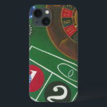 Roulette Table with Chips and Wheel iPhone 13 Case<br><div class="desc">The spinning wheel holds all the power on the roulette table, but the power of this painting is in the lifelike depiction of a casino scene. The green of the felt and the color of the chips puts you at the table, waiting on your bet to pay off. Be sure...</div>