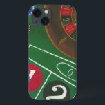 Roulette Table with Chips and Wheel iPhone 13 Case<br><div class="desc">The spinning wheel holds all the power on the roulette table, but the power of this painting is in the lifelike depiction of a casino scene. The green of the felt and the color of the chips puts you at the table, waiting on your bet to pay off. Be sure...</div>