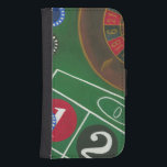 Roulette Table with Chips and Wheel Samsung S4 Wallet Case<br><div class="desc">The spinning wheel holds all the power on the roulette table, but the power of this painting is in the lifelike depiction of a casino scene. The green of the felt and the color of the chips puts you at the table, waiting on your bet to pay off. Be sure...</div>
