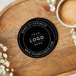 Round Custom Black Business Logo Website Paper Coaster<br><div class="desc">A sleek paper coaster featuring a bold black background with your business name arched above a custom logo and website address below in a classic circular stamp layout. Perfect as a branded accessory for corporate offices, bars, cafes, restaurants, and promotional giveaways. The business name, logo, and website fields are fully...</div>