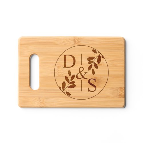 Round frame with olive branch and initials wedding cutting board