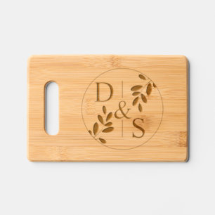 Round frame with olive branch and initials wedding engraved cutting board