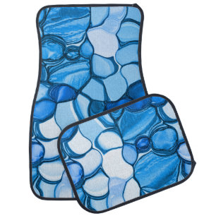 Round like stones in tones similar to royal blue car floor mat