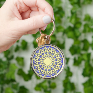 round sacred mandala in soft yellow background keychain