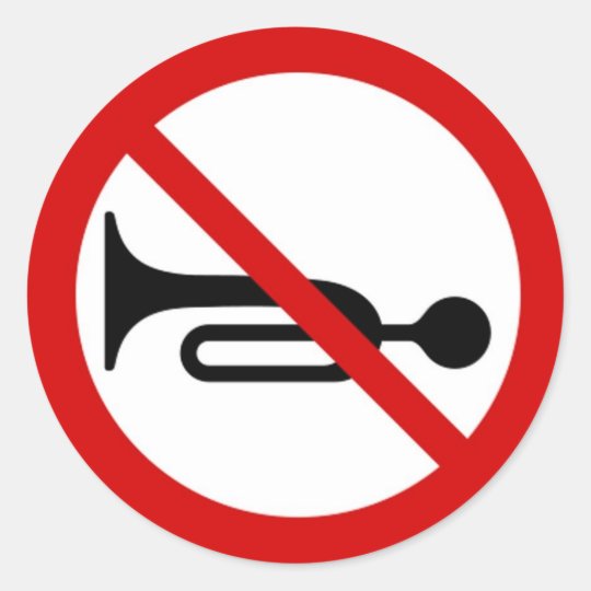 Round sticker with horn prohibited sign.