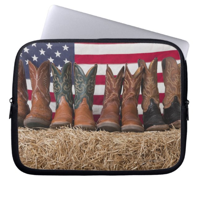 Row of cowboy boots on haystack laptop sleeve (Front)