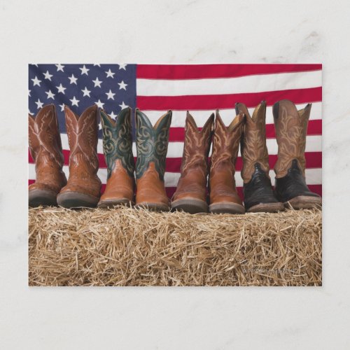 Row of cowboy boots on haystack postcard