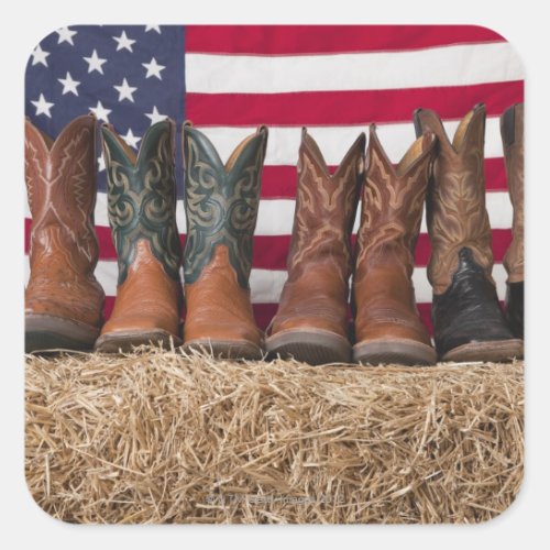 Row of cowboy boots on haystack square sticker