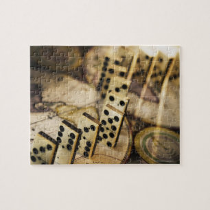 Row of dominoes on old world map 2 jigsaw puzzle