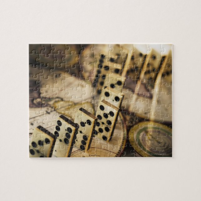 Row of dominoes on old world map 2 jigsaw puzzle (Horizontal)