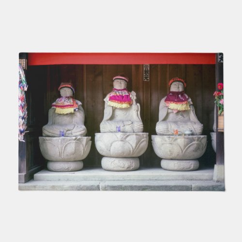 Row of Jizo monk statues with bib and hat _ Japan  Doormat