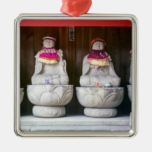 Row of Jizo monk statues with bib and hat _ Japan Metal Ornament