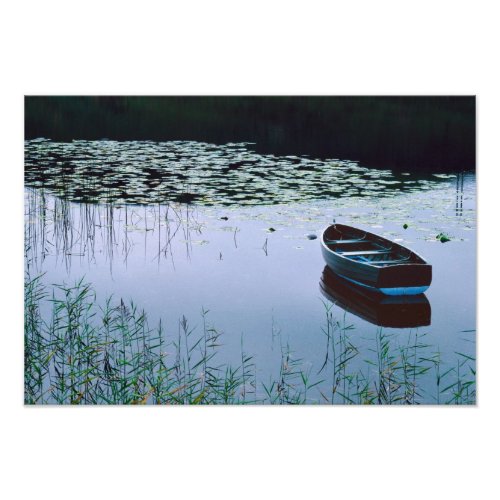 Rowboat on small lake surrounded by water photo print