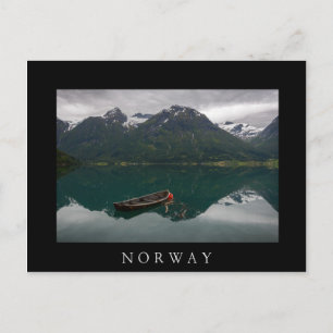 Rowboat with mountains reflection in Norway Postcard