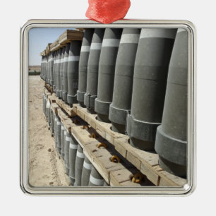 Rows of ammunition are stacked and prepped metal ornament
