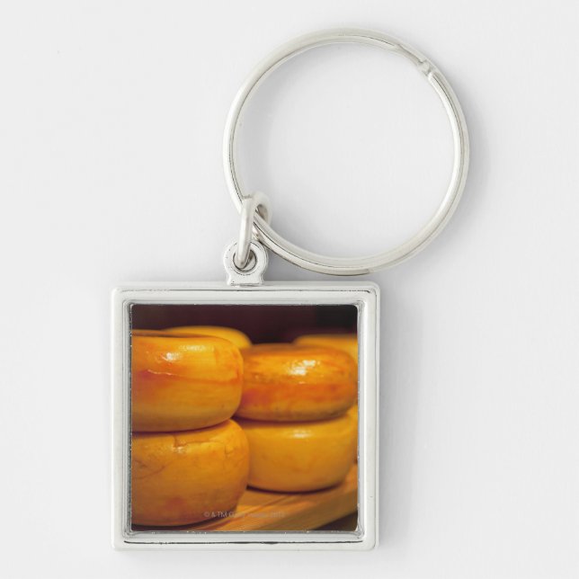 rows of colourful yellow Edam cheeses lined up Keychain (Front)