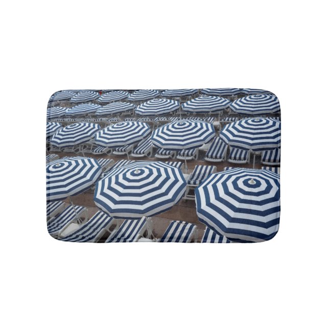 Rows Of Striped Beach Umbrellas With Sun Beds Bathroom Mat (Front)