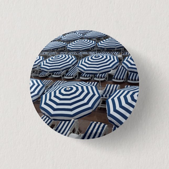 Rows Of Striped Beach Umbrellas With Sun Beds Button (Front)