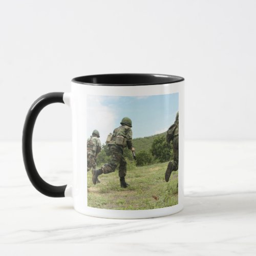 Royal Thai Marines rush forward to secure the s Mug