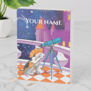 Rufous beige puppy and telescope in the castle wooden box sign