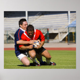 Rugby players fighting for ball poster