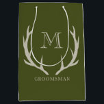 Rustic Army Green Antler Custom Groomsmen Gift Medium Gift Bag<br><div class="desc">Elevate your groomsmen gifts with our exquisite Gift Bag, an ideal token for proposing to your groomsmen or honoring your best man. Crafted with a fusion of rustic charm and contemporary style, this bag features an army green design complemented by soft amber/beige antler motifs and personalized monogram initials. Embrace the...</div>